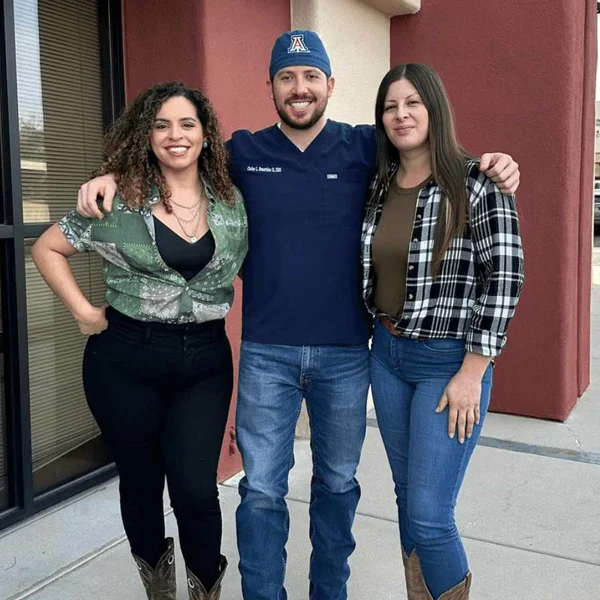 Dr. Carlos Benavides and the clinic staff standing outside